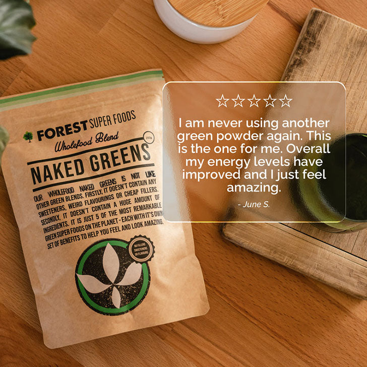 Naked Greens Whole Multivitamin Powder pouch with customer review highlighting energy boost and natural green superfoods blend